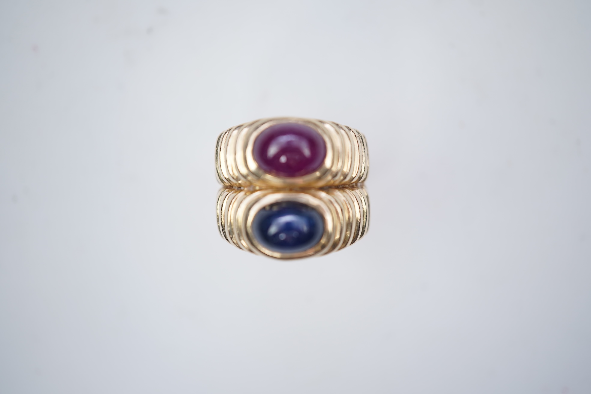 A sapphire and ruby ring
